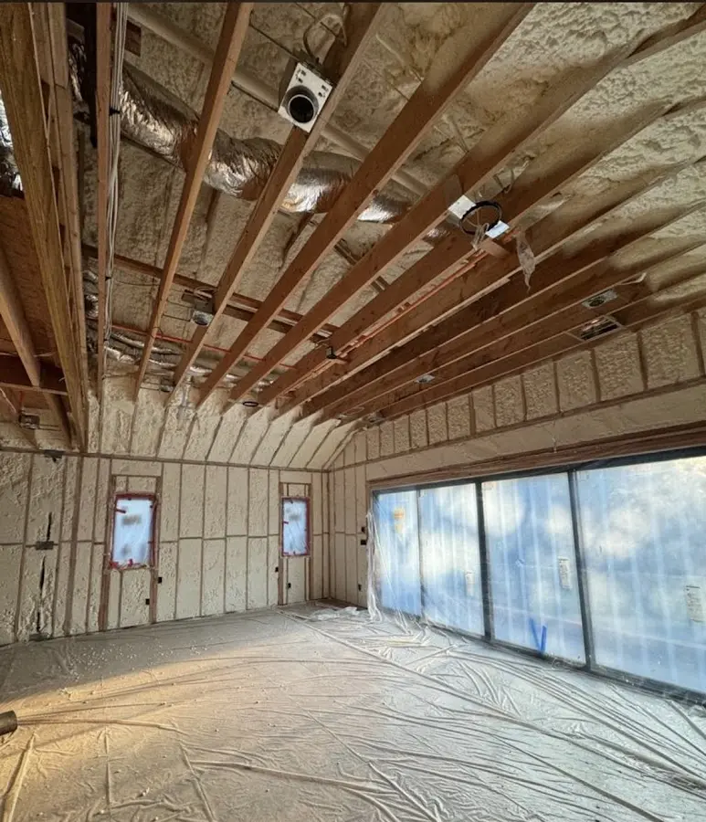 Interior walls and ceiling insulated with spray foam during new construction in St. Cloud